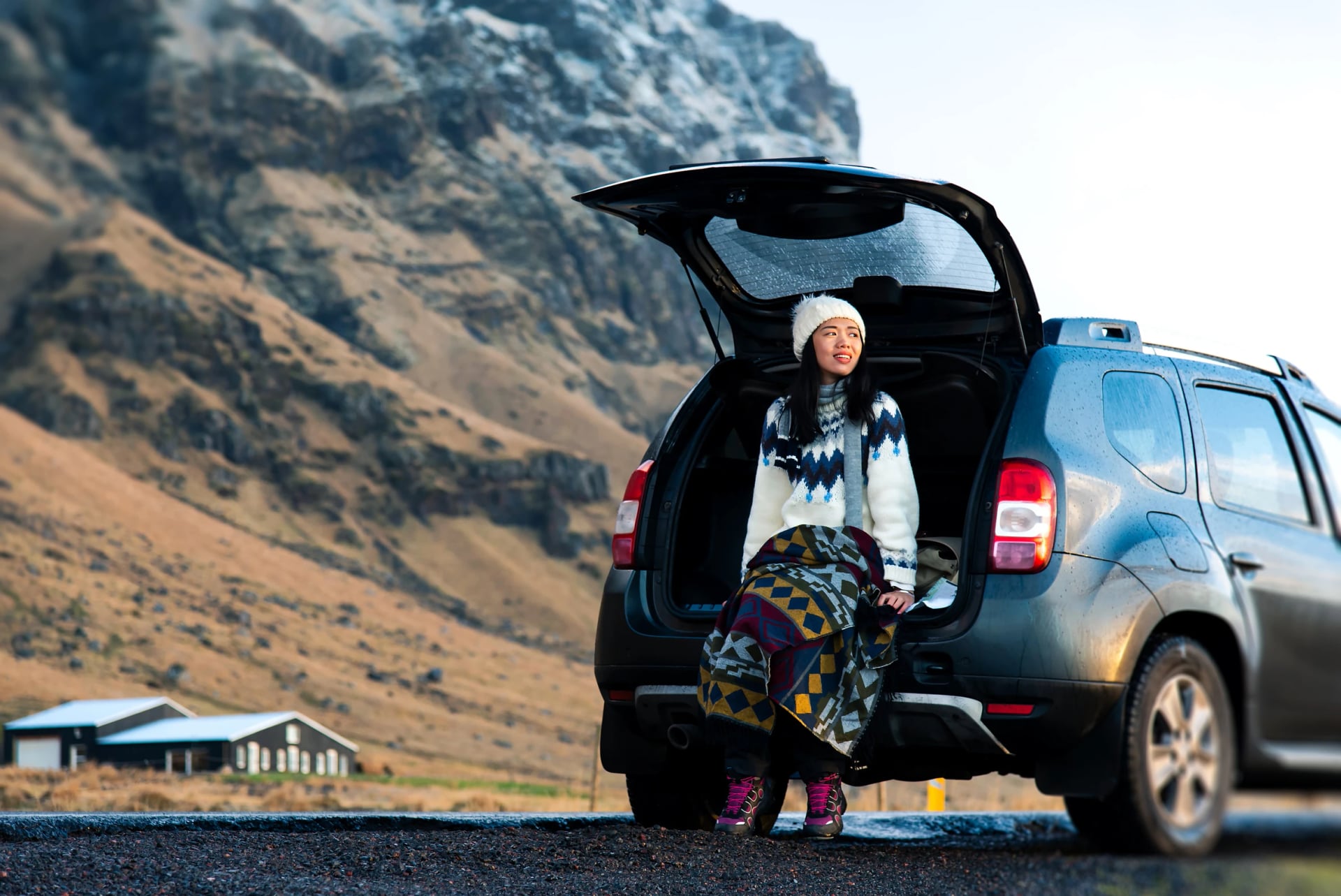 Female traveler enjoying Iceland view from the car