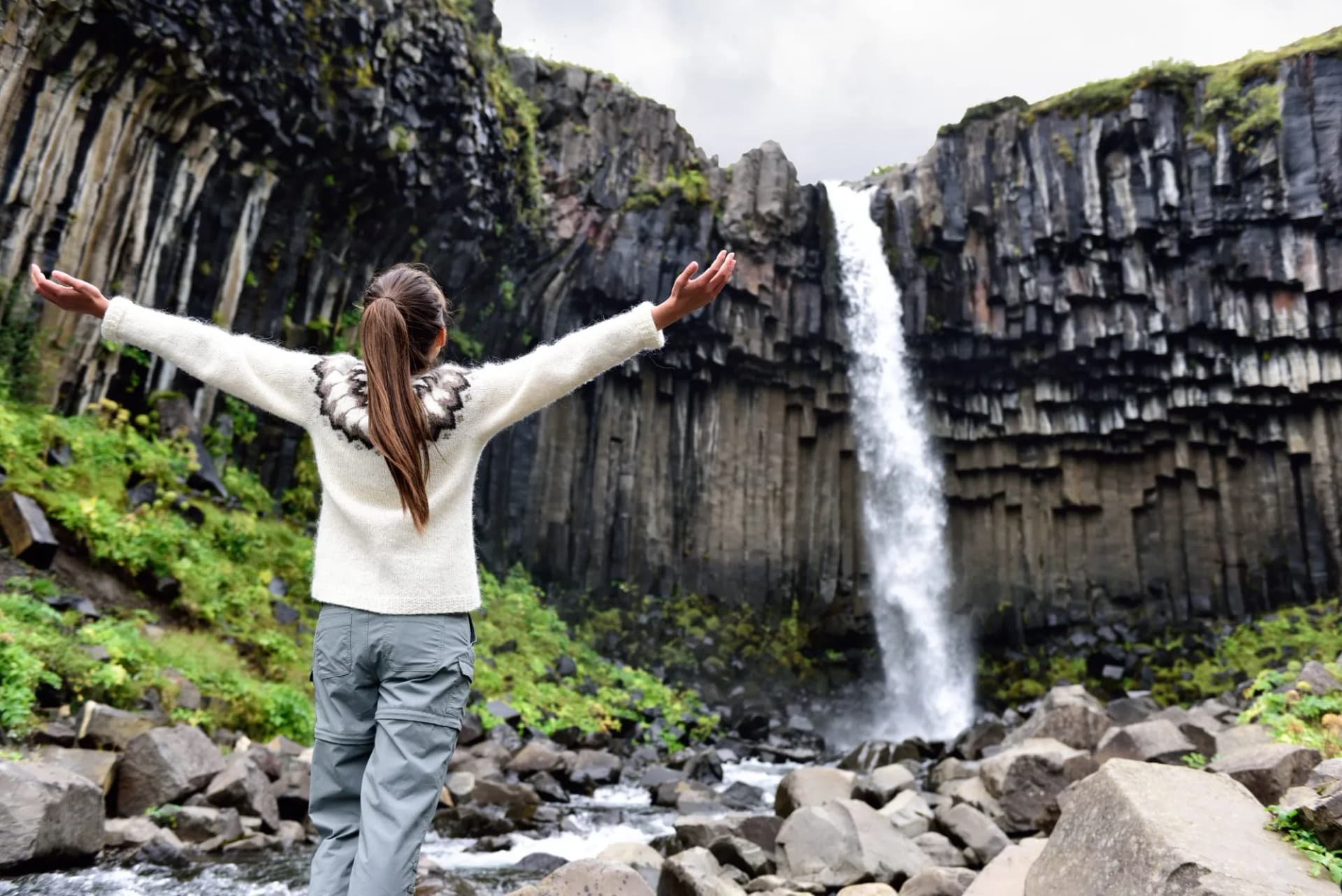 girl at svartifoss waterfall