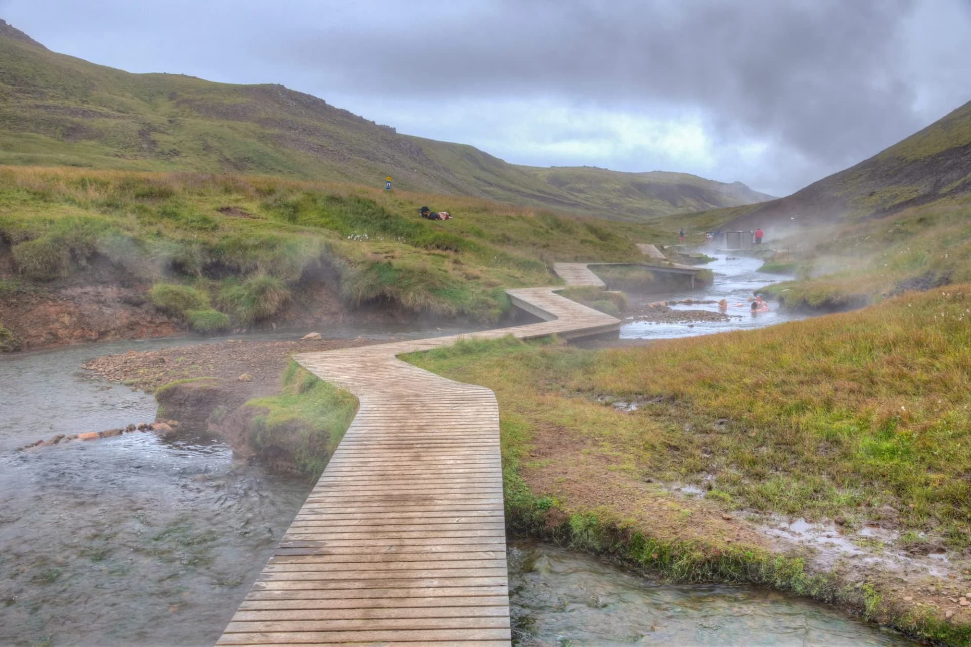 walk among bubbling hot springs reykjadalur