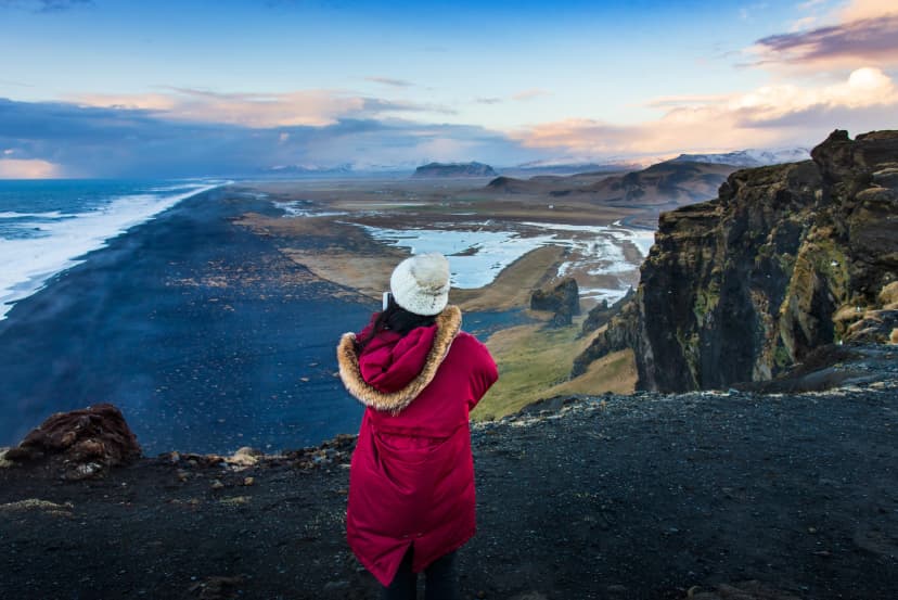 Traveler fotographing the Black sand beach view in Iceland