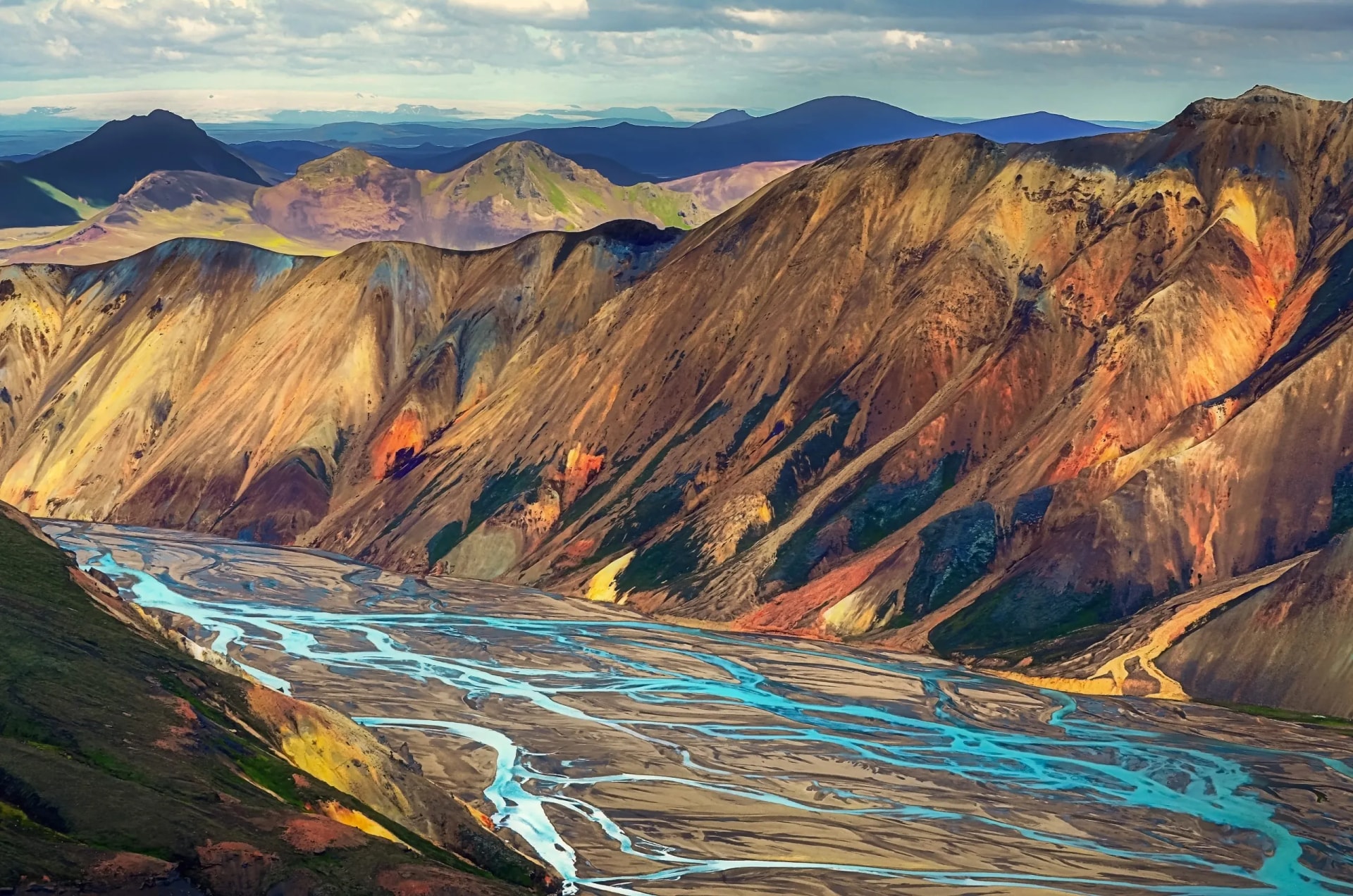 Landscape view of Landmannalaugar colorful volcanic mountains and braided river.